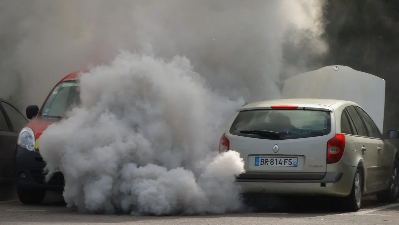 A car engulfed in exhaust smoke